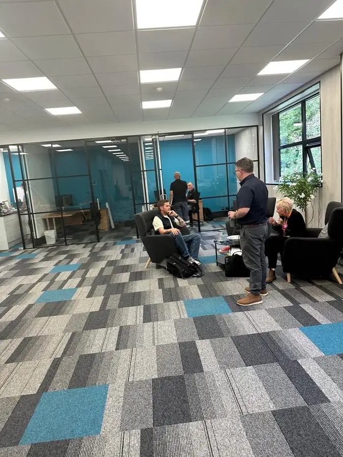 Managers talking at the Sheffield office